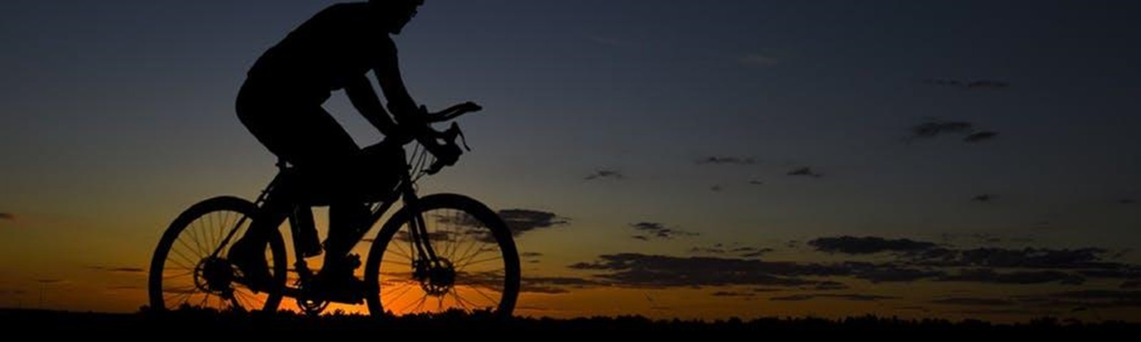 Man with bike during Nightfall